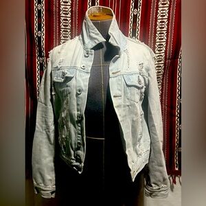 Women’s distressed white jean jacket